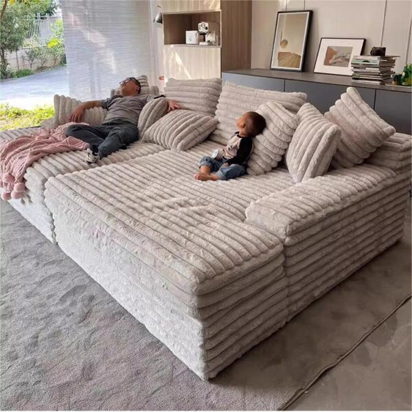 Ultra‑cozy low‑profile cloud chaise lounge, plush striped faux rabbit fur modular sofa, ideal for long‑time relaxing and napping.
