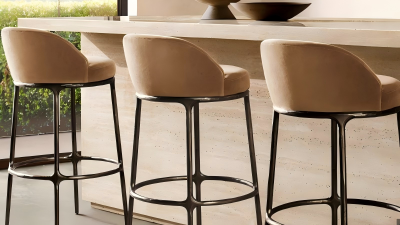 hand forged bar stool with bespoke upholstered seat and textured artisanal metal frame