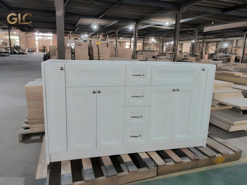Unfinished custom cabinet furniture placed on pallet inside large furniture manufacturing factory